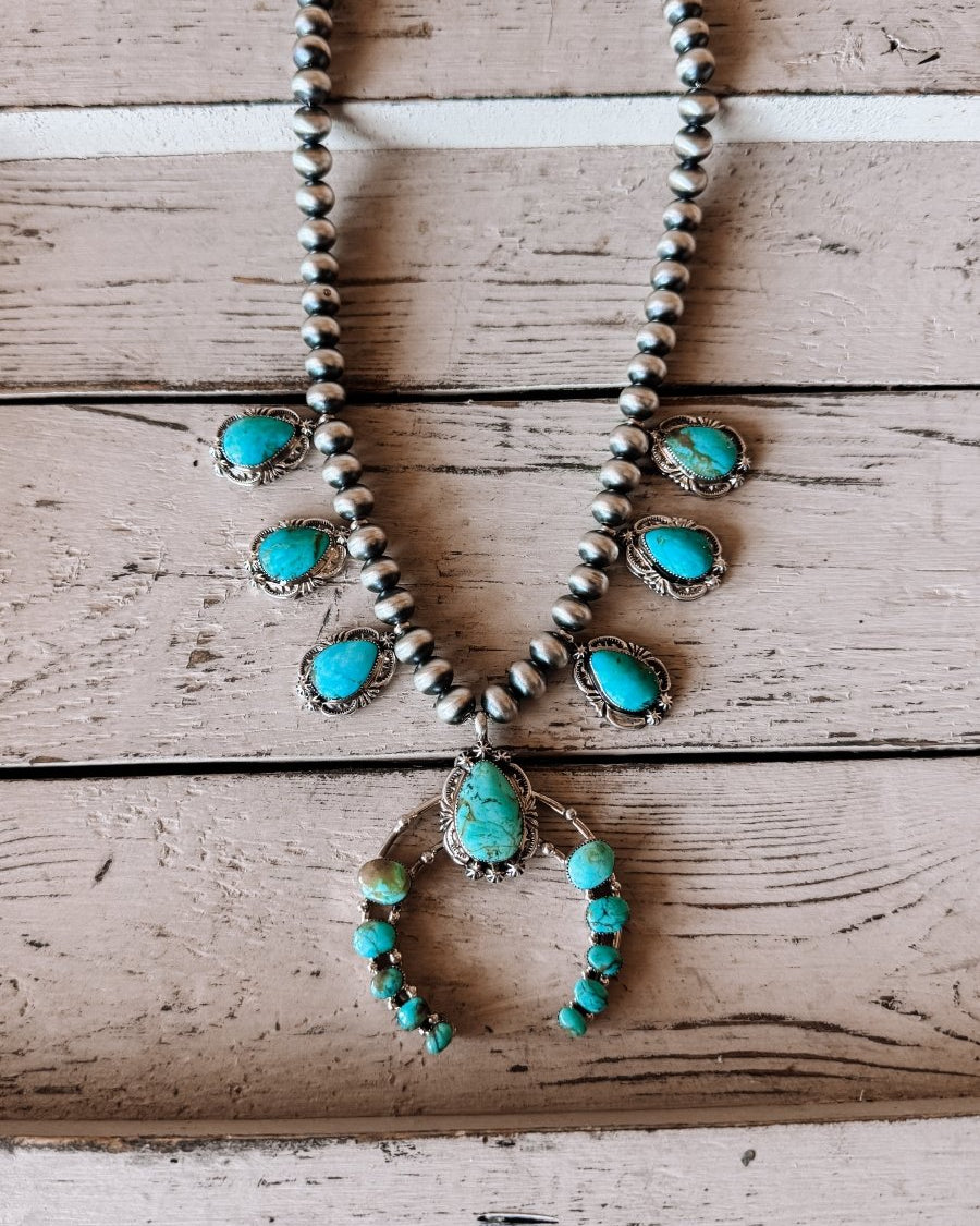 Two Stories Wide Turquoise Squash Blossom - Horseshoe J & Co.