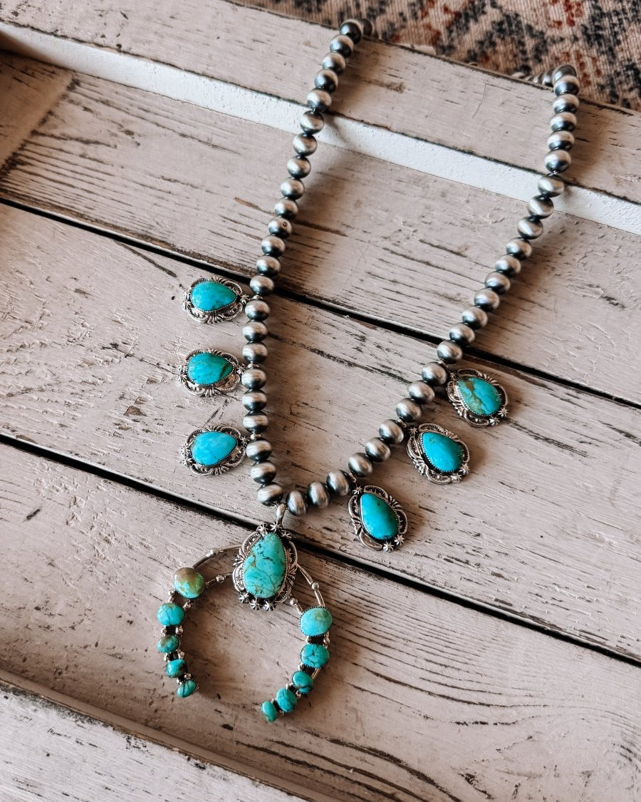 Two Stories Wide Turquoise Squash Blossom - Horseshoe J & Co.