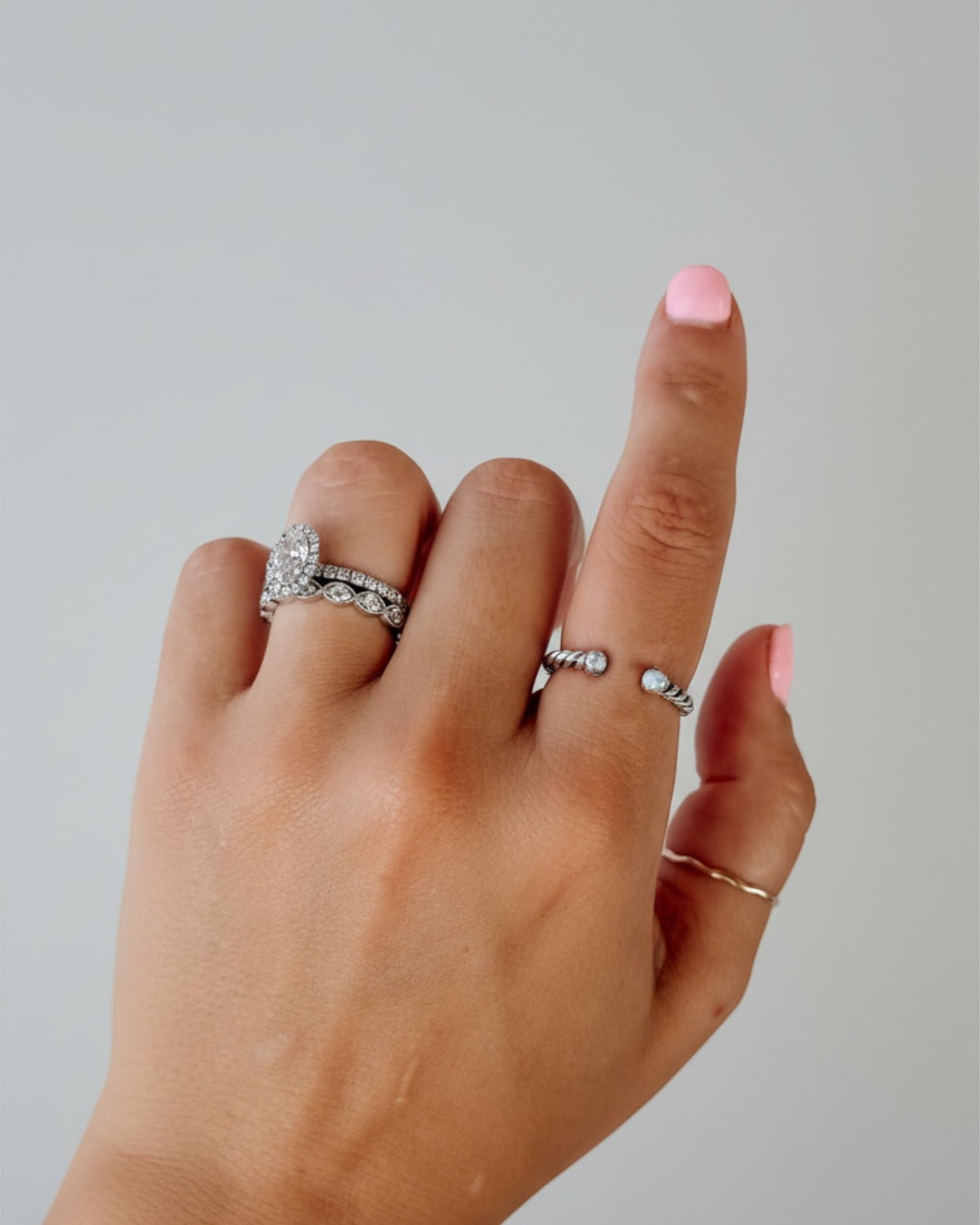 Wooten & Co. Nazareth adjustable sterling silver twist ring featuring mother of pearl stones on a finger