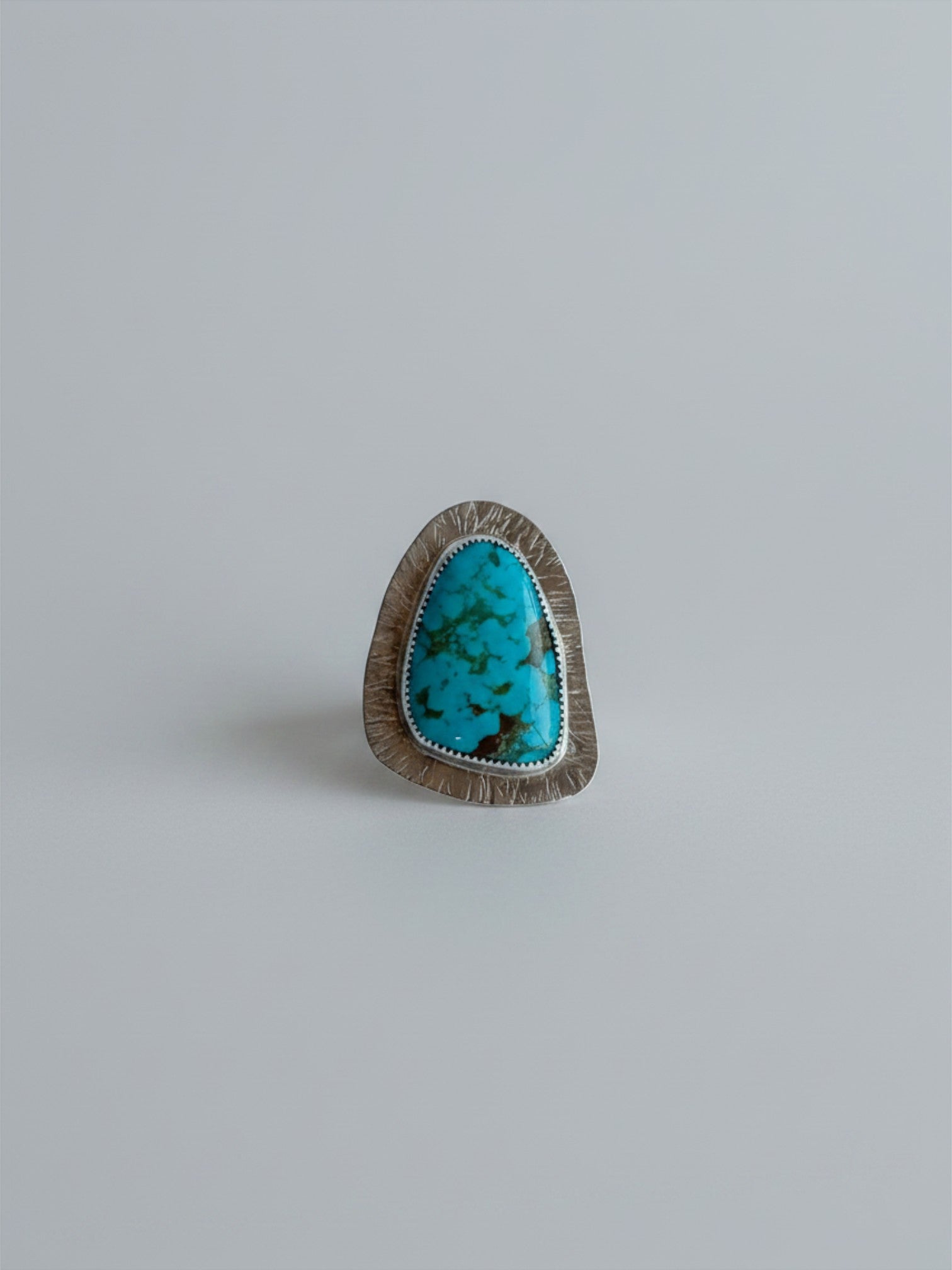 Wooten & Co. Palmer turquoise statement ring featuring a genuine stone in a textured sterling silver setting