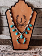 Two Stories Wide Turquoise Squash Blossom - Horseshoe J & Co.
