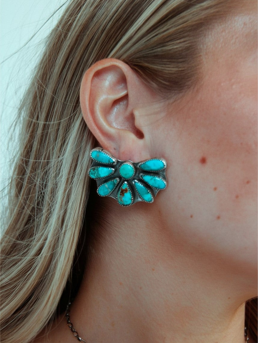 Wooten & Co. Avery turquoise cluster earrings featuring genuine stones set in sterling silver on a model