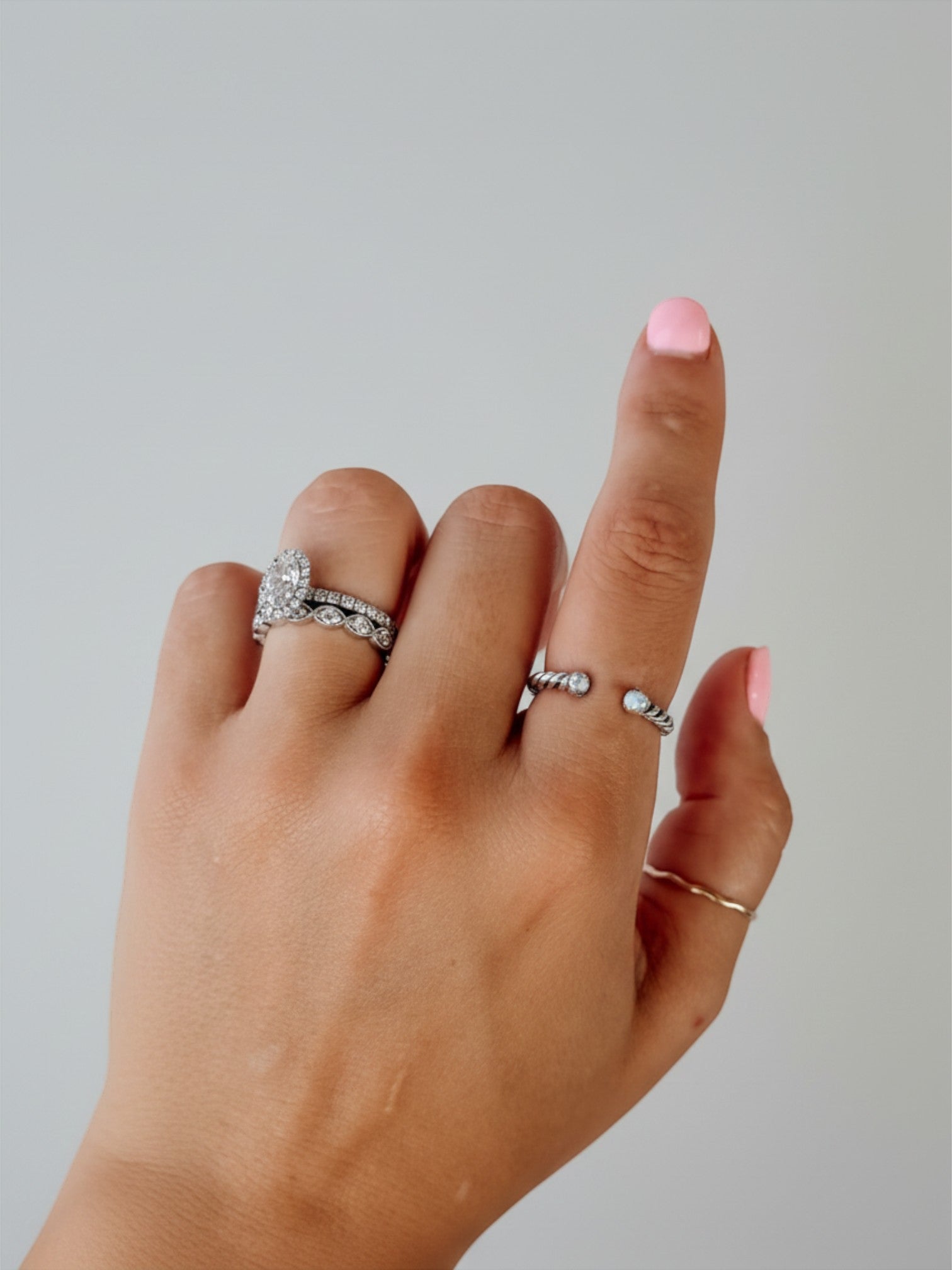 Wooten & Co. Nazareth adjustable sterling silver twist ring featuring mother of pearl stones on a finger
