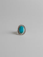 Wooten & Co. Palmer turquoise ring featuring a genuine oval stone in a textured sterling silver setting.