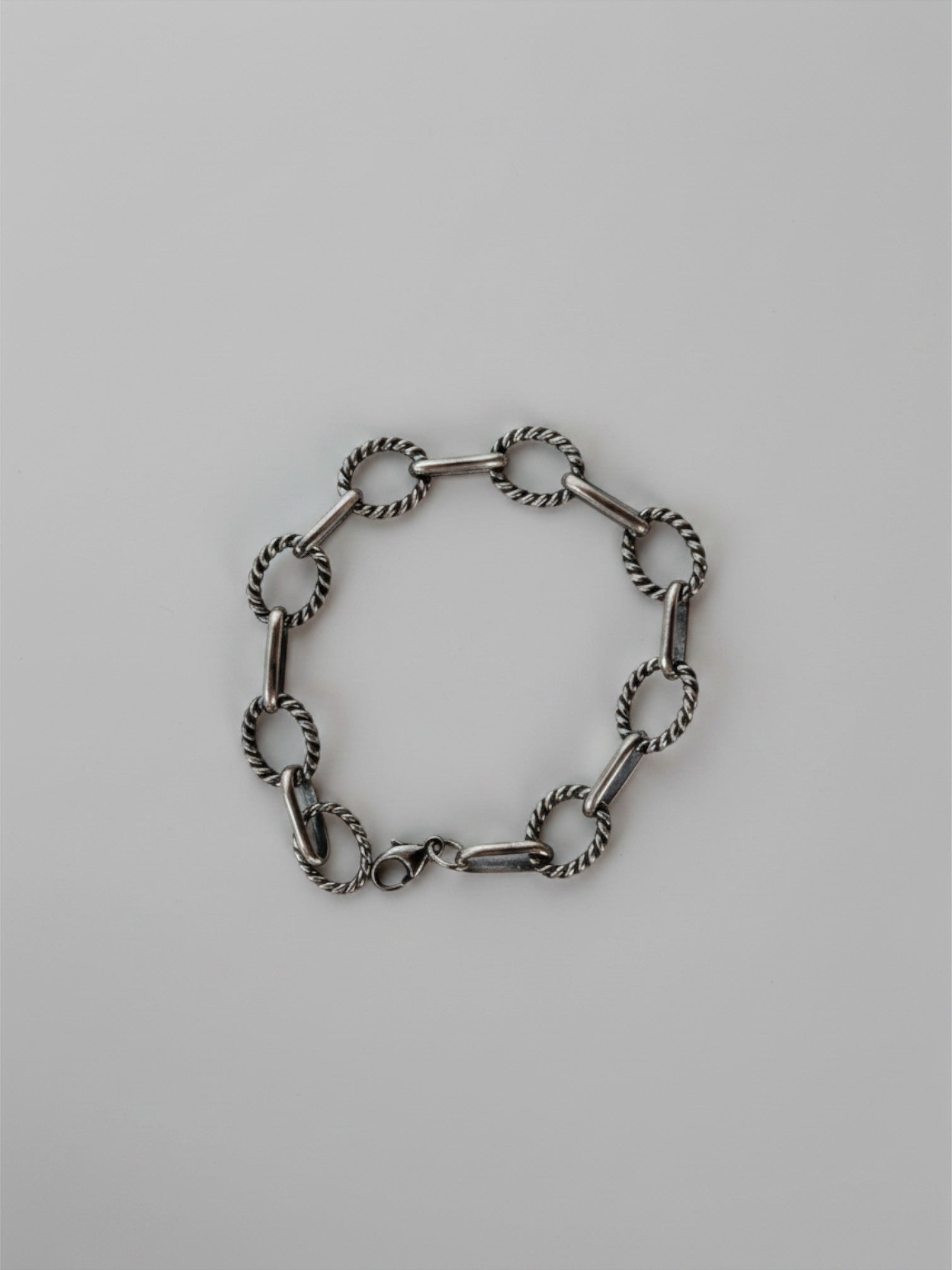 Wooten & Co. Ranchester sterling silver chain bracelet with alternating smooth and twisted links on a white background