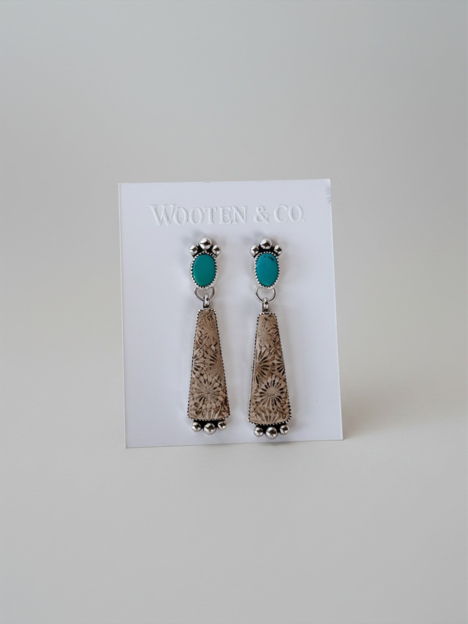 Wooten & Co. Summerfield earrings featuring turquoise stones and fossilized coral set in sterling silver.