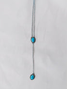 Wooten & Co. Paducah lariat necklace featuring two genuine turquoise stones set in sterling silver on a delicate chain.