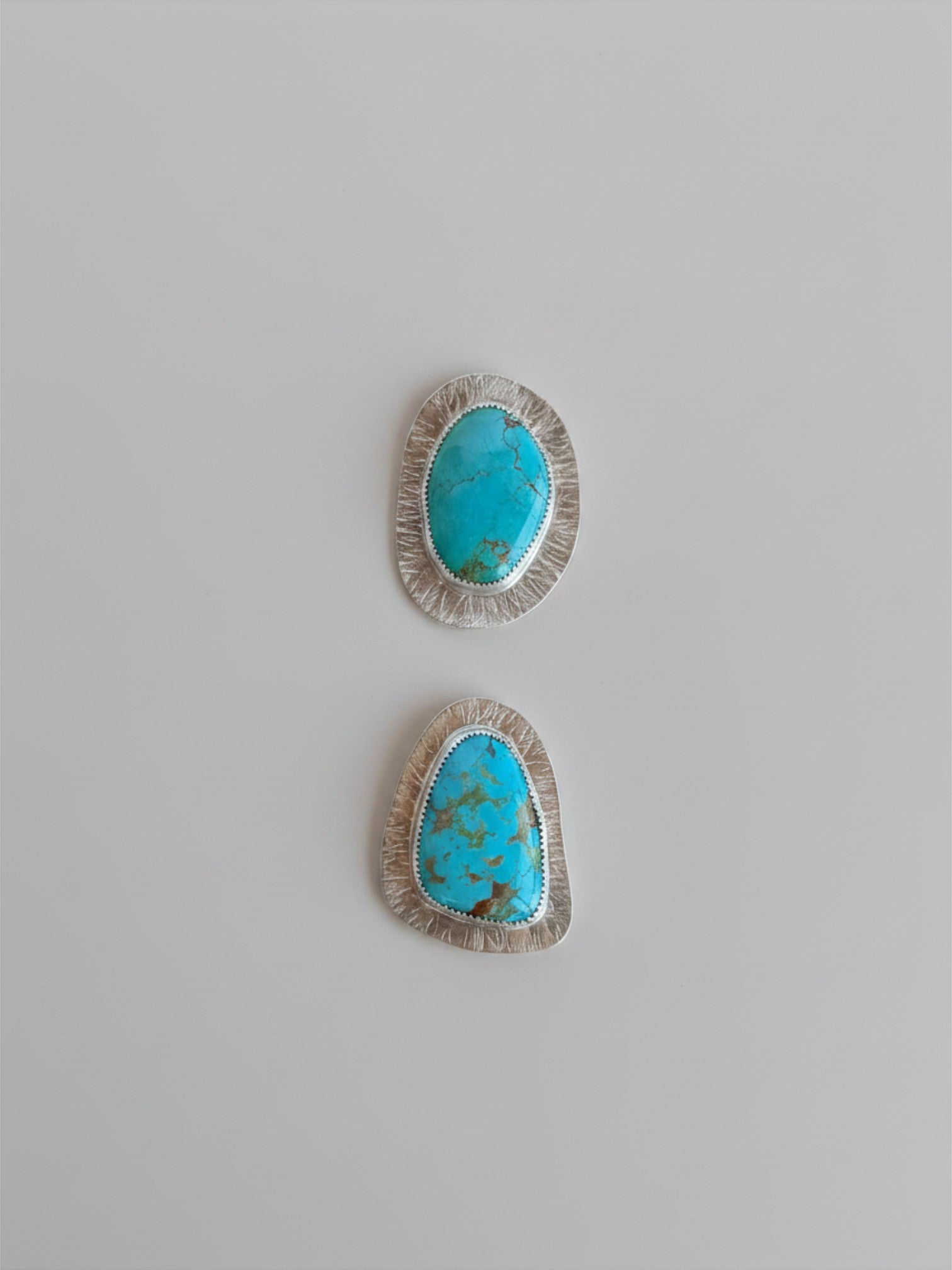 Wooten & Co. Palmer turquoise statement rings in sterling silver with intricate linear textured settings